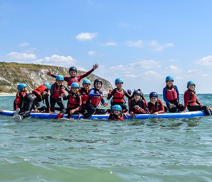 kids Club on a giant jumbo paddleboarding