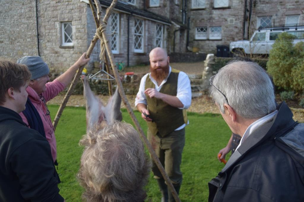 Butchering a deer on a bushcrafting course in the Purbecks, Dorset.