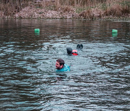 people swimming in a lake