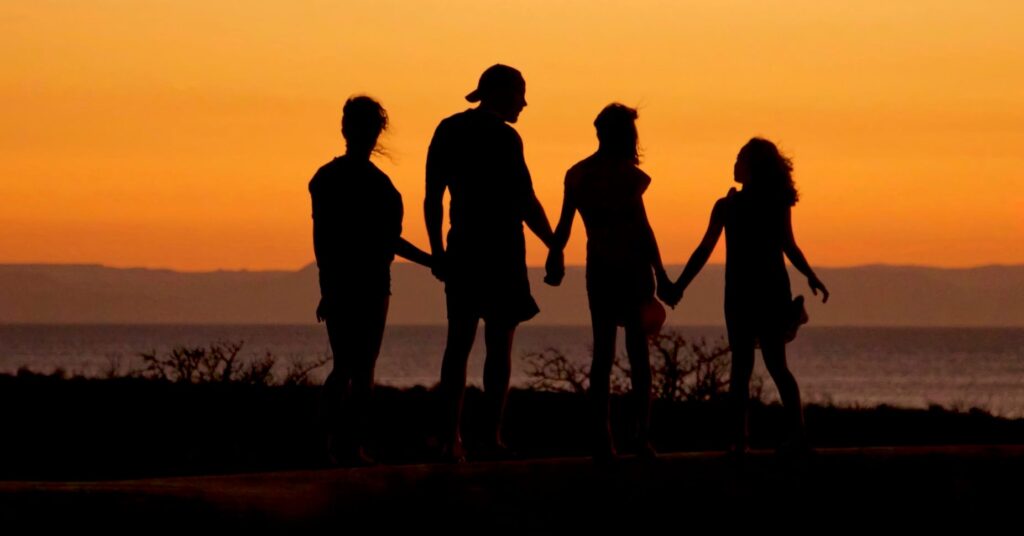 Family bubble hold hands during Covid-19 lockdown