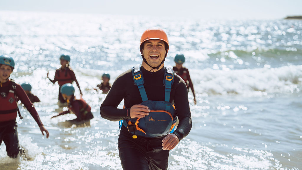 Instructor running on the beach 