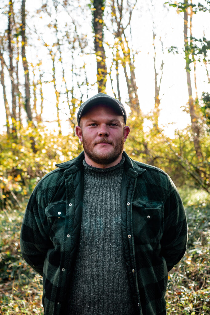 Outdoor instructor doing bushcraft in the woods 